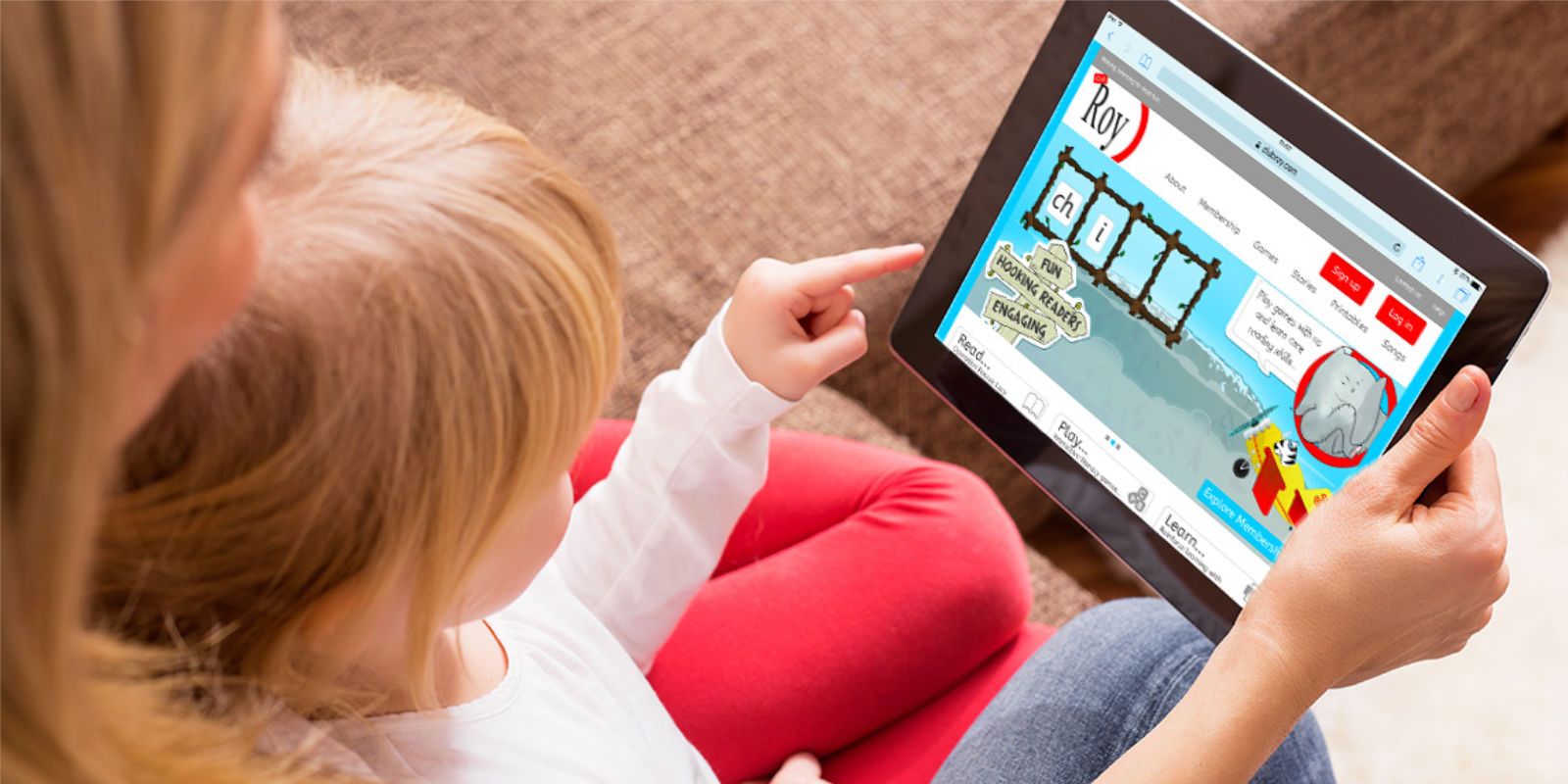 Image of child playing one of our html5 games on a tablet